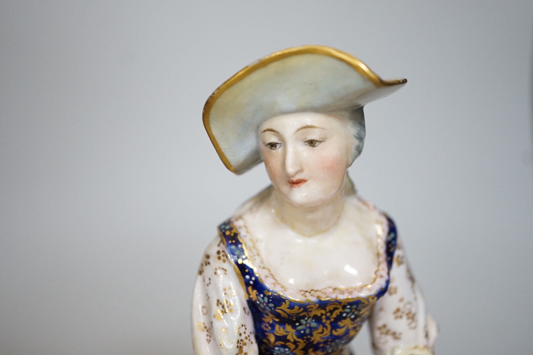 A pair of Royal Crown Derby figures of a Shepherd and shepherdess, 23cm